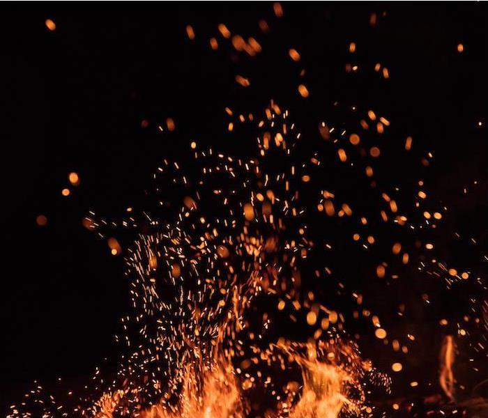 a close up view of a bright campfire burning at night